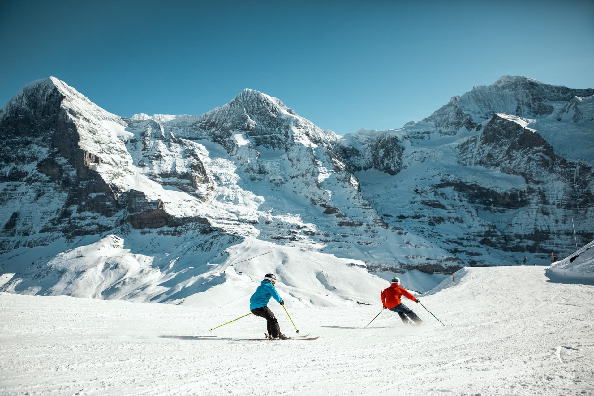 Couple of skiers on Grindelwald ski resort slope